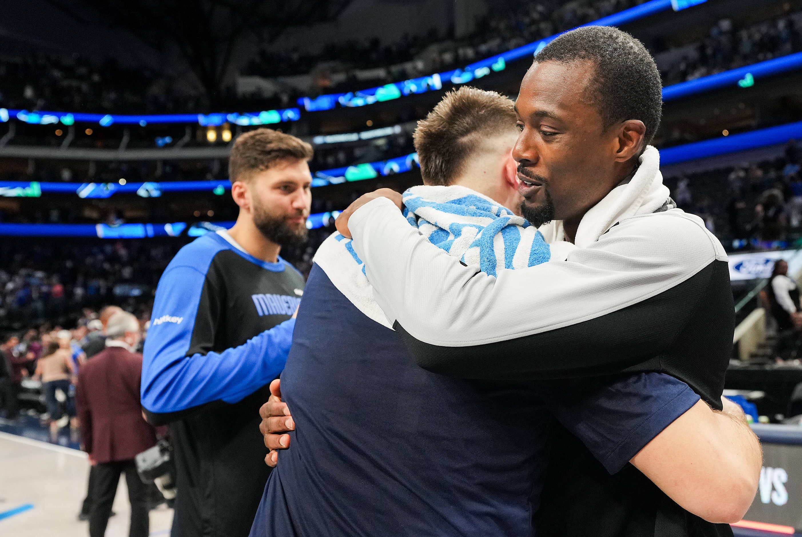 San Antonio Spurs forward Harrison Barnes (40) hugs Dallas Mavericks guard Luka Doncic after...