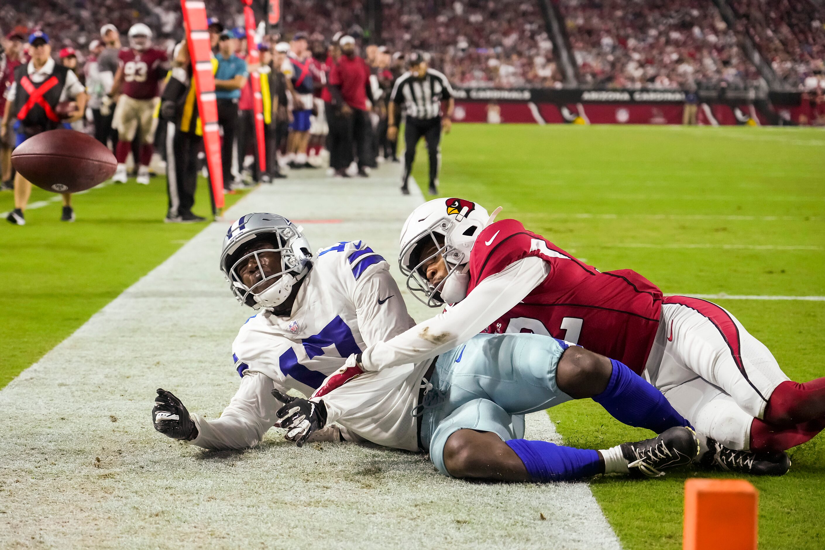 Dallas Cowboys wide receiver Malik Turner (17) is injured on a pass play as Arizona...