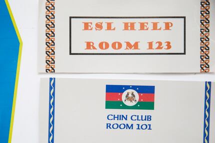 Signs promoting help for English as a Second Language and the Chin Club hang in a hallway at...