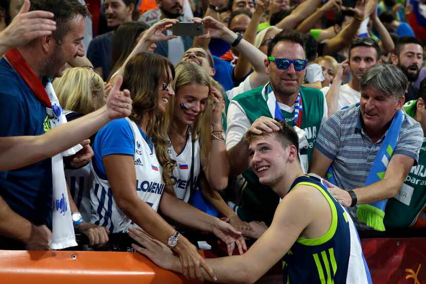 In this Sept. 14, 2017, file photo, Slovenia's Luka Doncic celebrates with the supporters at...