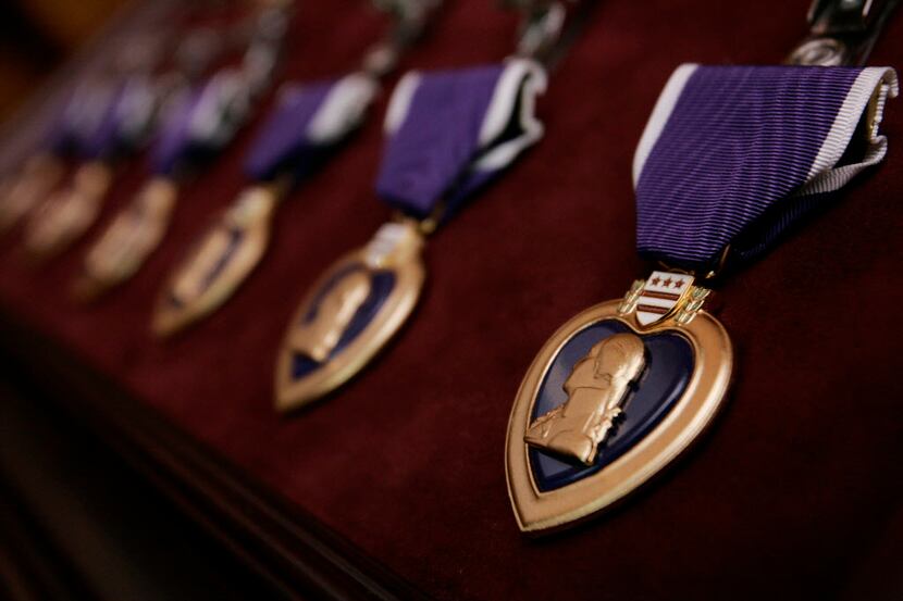 Purple Heart medals, bearing the image of Gen. George Washington, are seen prior to the...