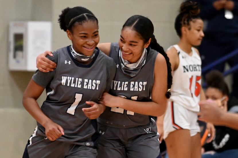 Wylie East’s Taylor Dailey (1) and Aleena Dawkins celebrate their double overtime win during...