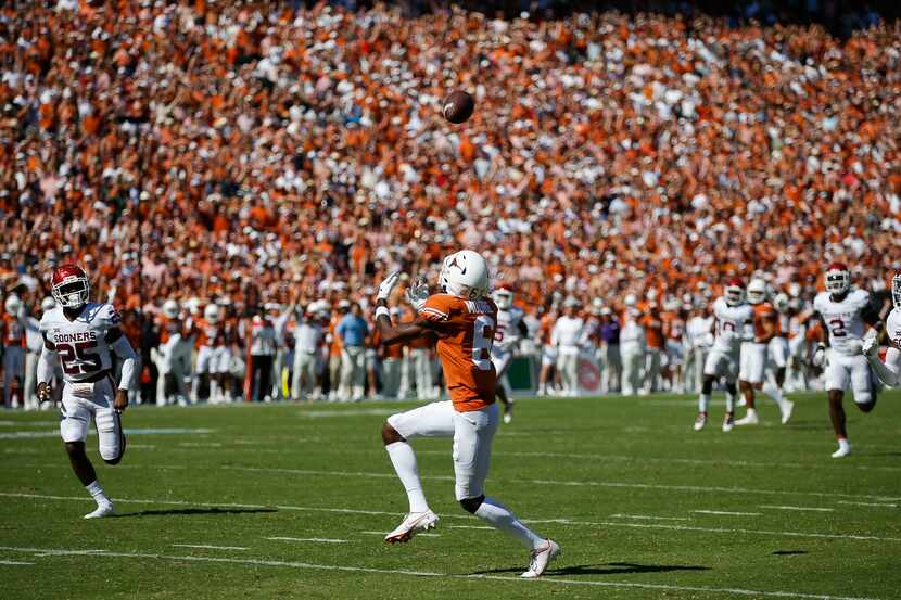 Texas wide receiver Joshua Moore (6) catches a pass and runs it in for a touchdown during...