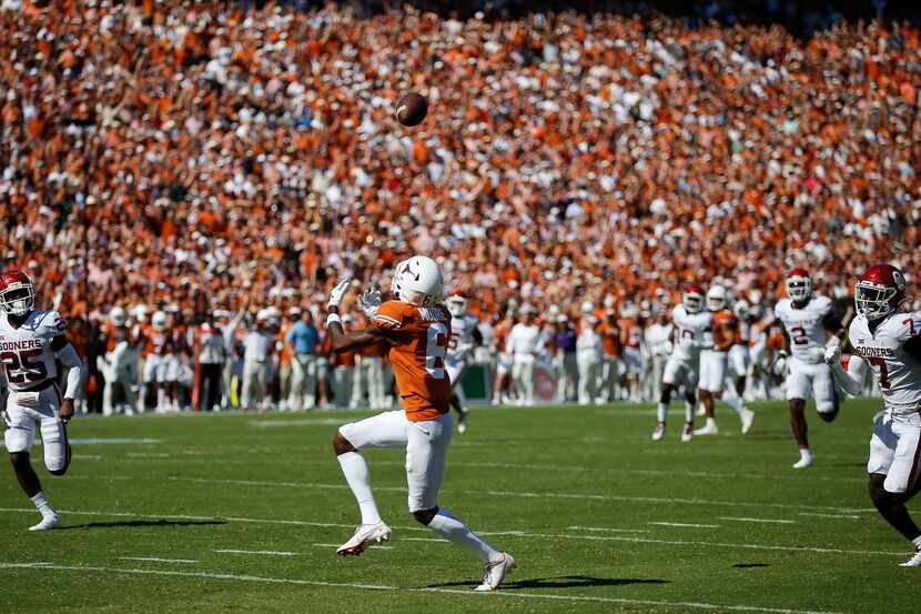 Texas wide receiver Joshua Moore (6) catches a pass and runs it in for a touchdown during...