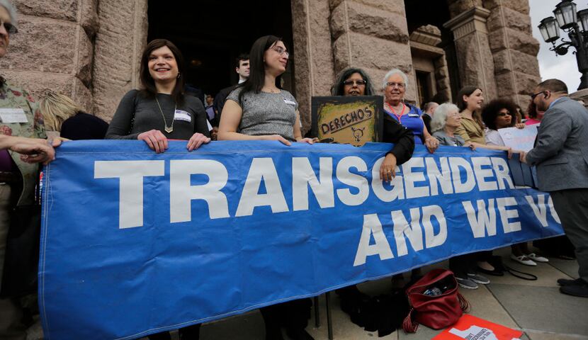 Members of the transgender community take part in a rally on the steps of the Texas Capitol,...