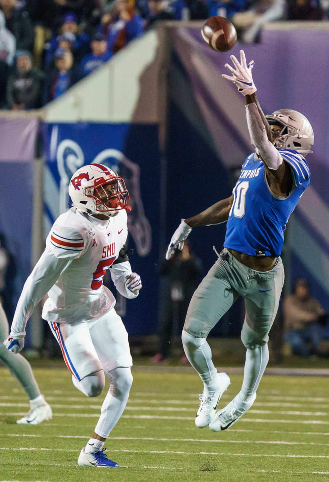 Memphis wide receiver Damonte Coxie (10) makes a one-handed catch past SMU cornerback...