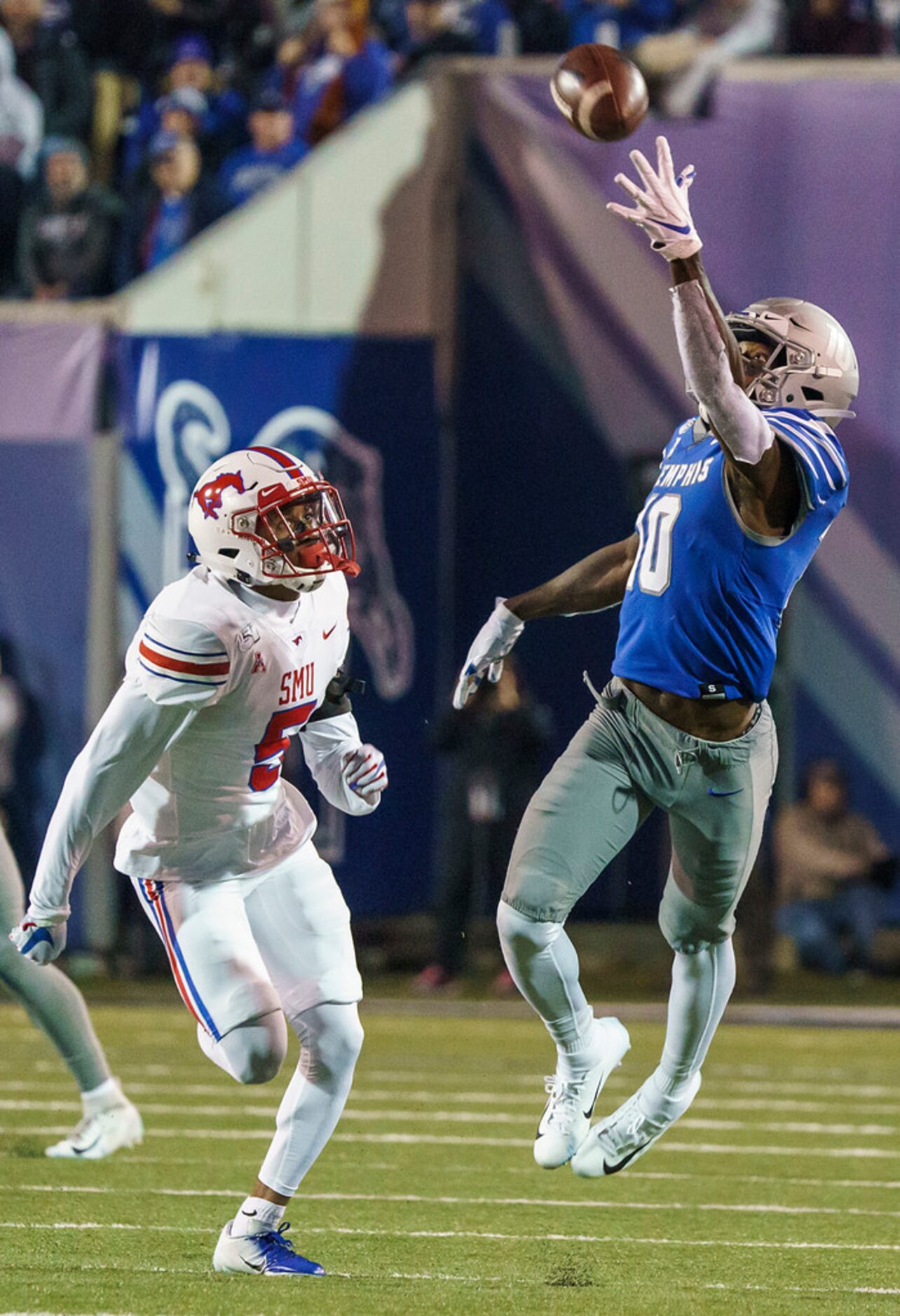 Memphis wide receiver Damonte Coxie (10) makes a one-handed catch past SMU cornerback...