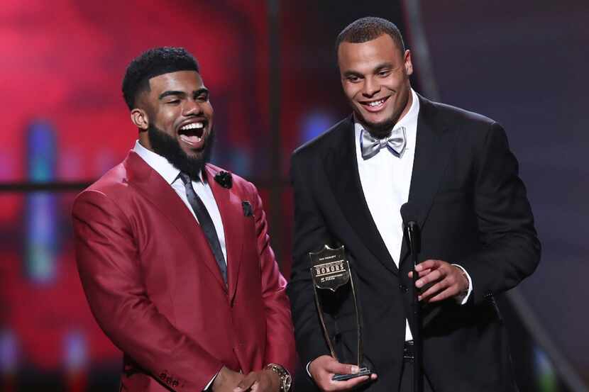 Ezekiel Elliott, left, and Dak Prescott of the Dallas Cowboys accept their award for AP...