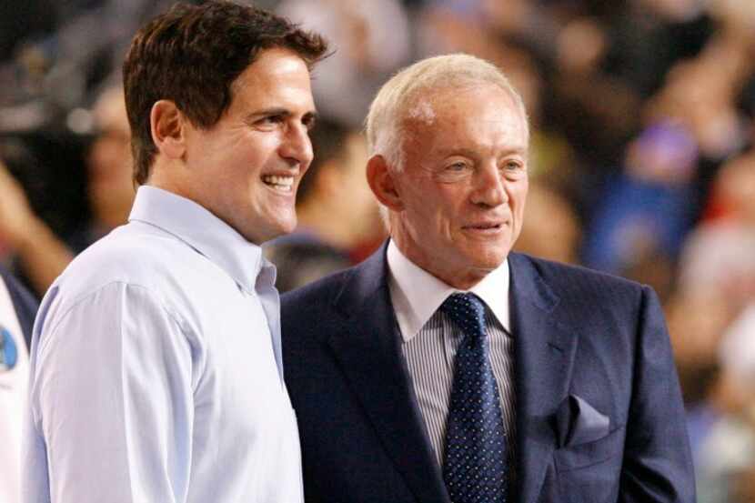 Dallas Mavericks owner Mark Cuban, left, and Dallas Cowboys owner Jerry Jones, right,...