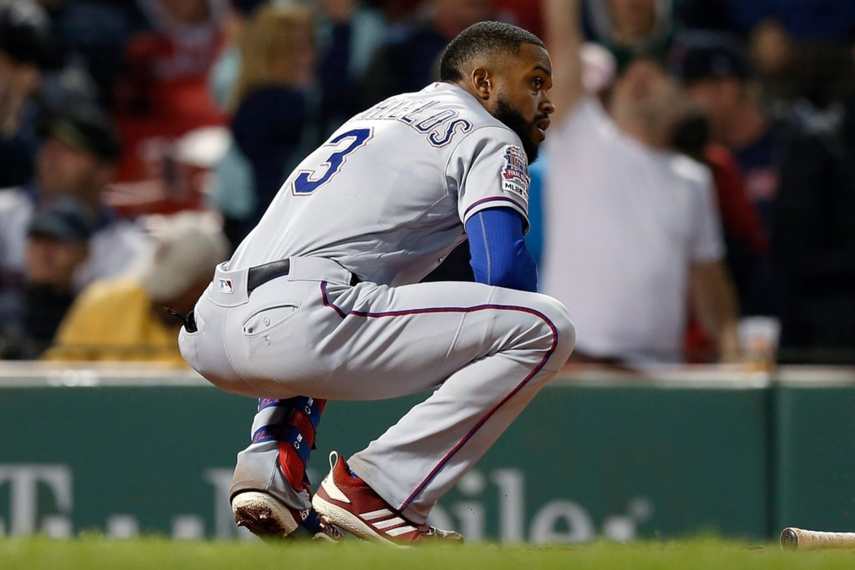 Texas Rangers' Delino DeShields reacts after striking out swinging with bases loaded to end...