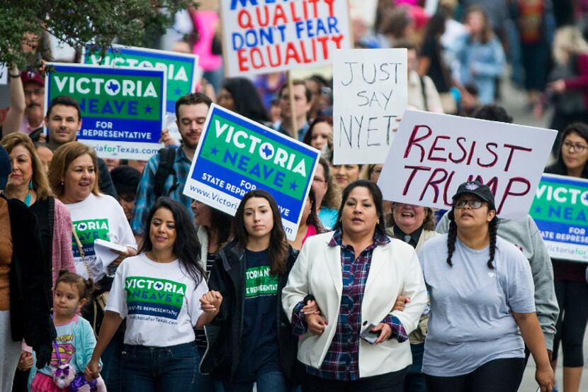 Texas State Rep. Victoria Neave (bottom left) marches at the lead of the Dallas Women's...