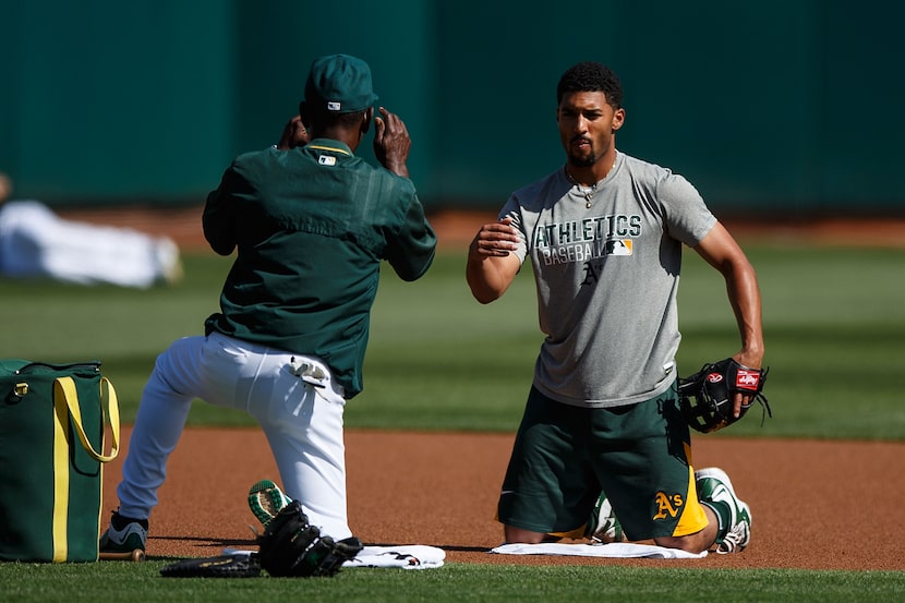 OAKLAND, CA - APRIL 13:  Marcus Semien #10 of the Oakland Athletics participates in fielding...