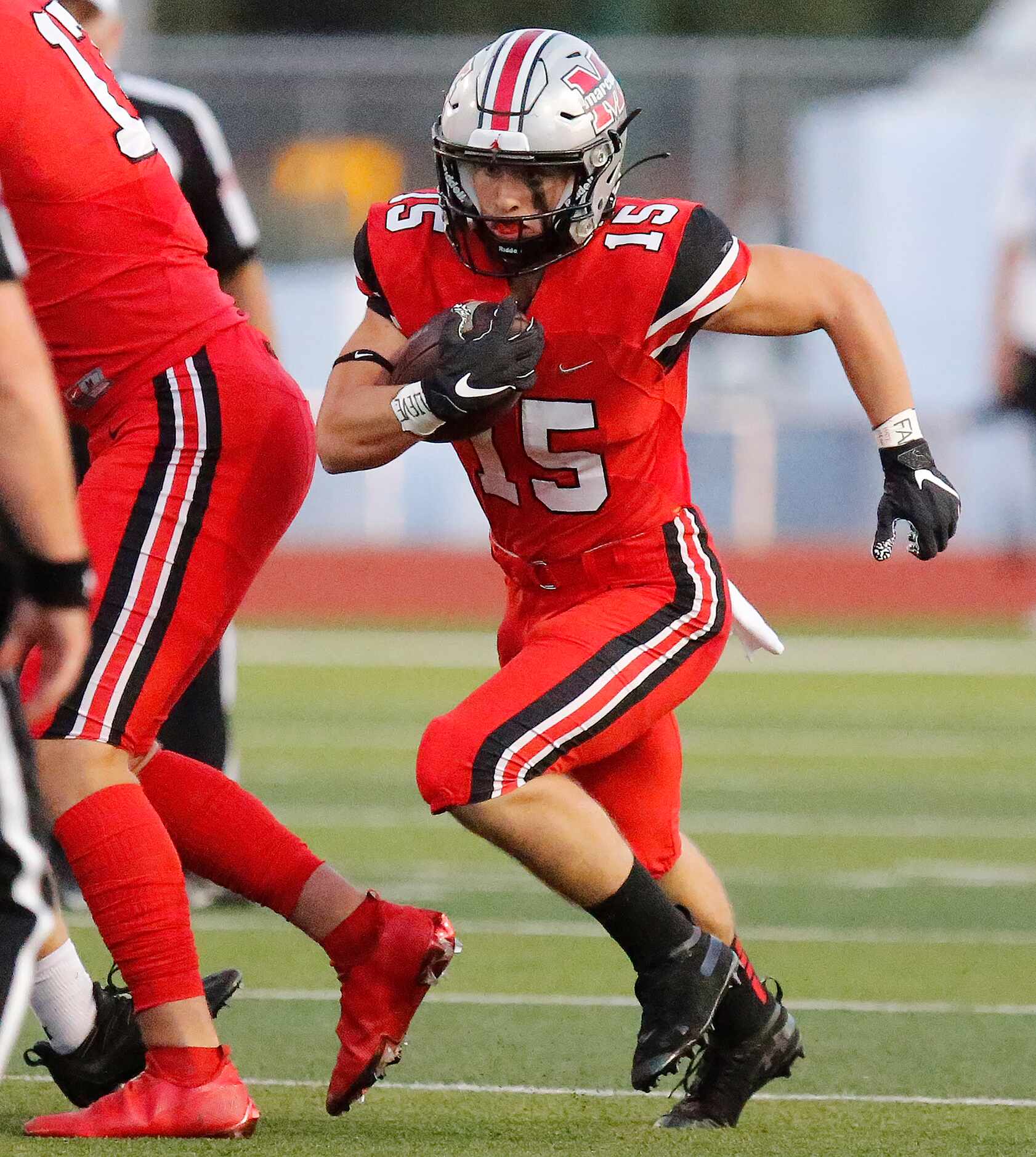 Flower Mound Marcus High School running back Gabe Espinoza (15) finds room to run during the...