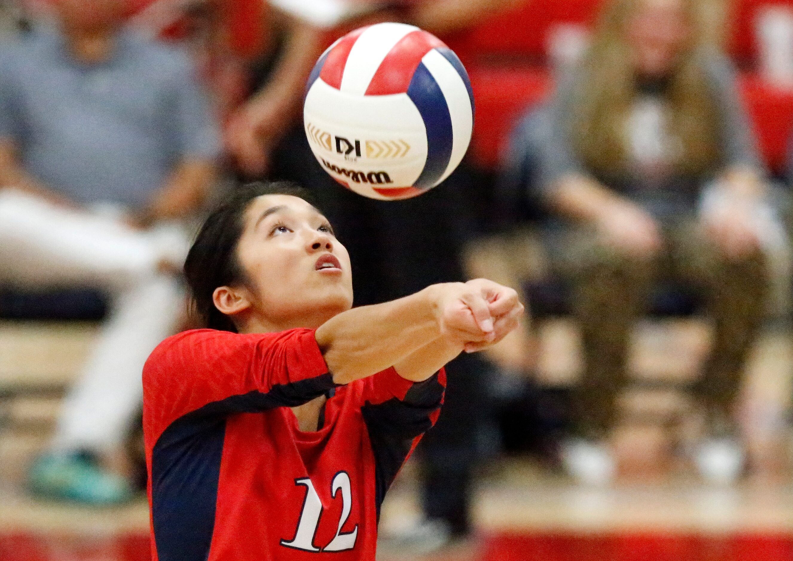 John Paul II High School setter Ella Ahang (12) makes a bump set during game two as John...