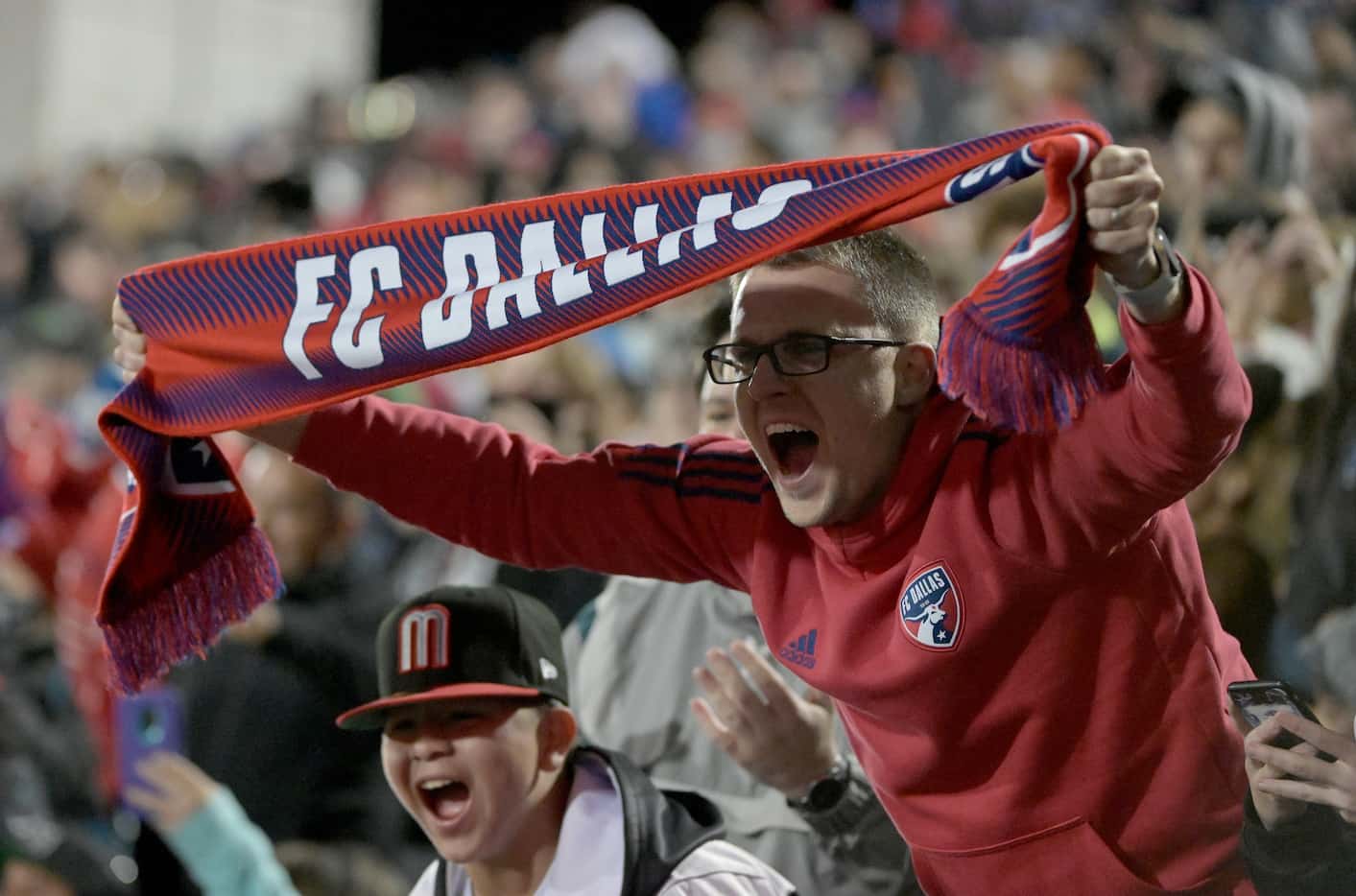 FC Dallas fan Daniel Jackson cheers after a goal in the second half during a MLS soccer game...