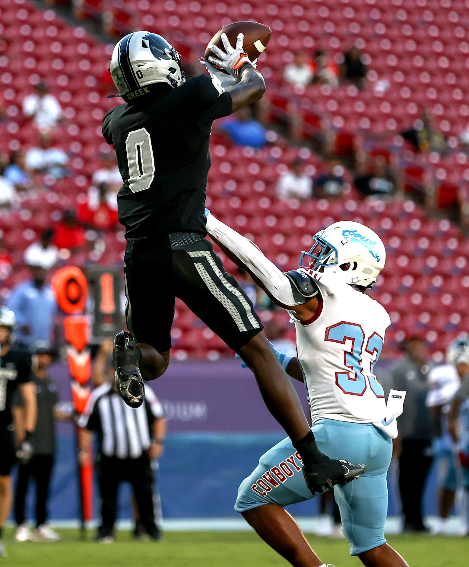 Frisco Panther Creek wide receiver Jalen Lott (0) goes up over Dallas Carter linebacker...