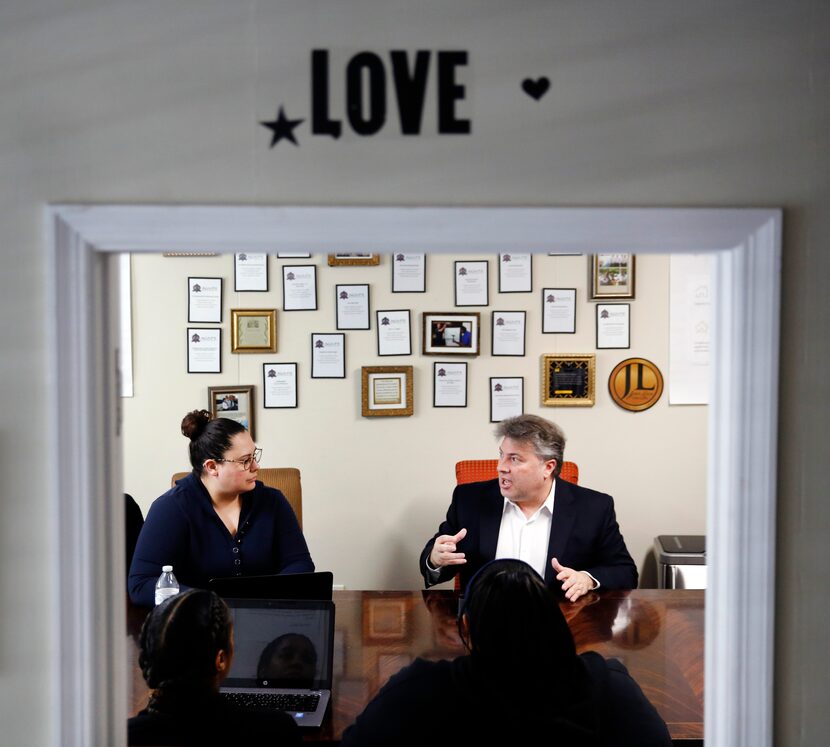 Financial counselor Todd Mark (right) delivers money advice to staffmember Adriana Balderas...