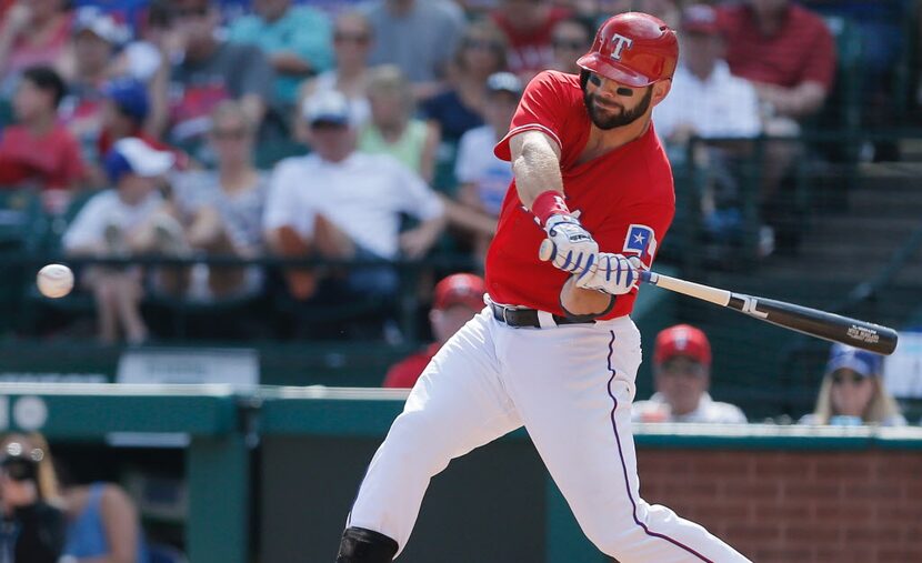 ARLINGTON, TX - SEPTEMBER 03: Mitch Moreland #18 of the Texas Rangers makes contact for a...