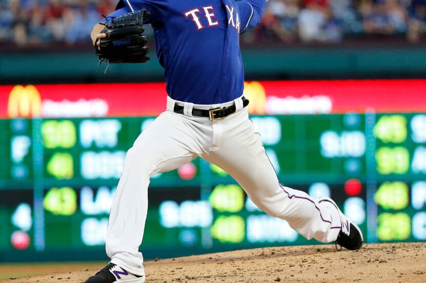 Texas Rangers starting pitcher Cole Hamels (35) pitches in the third inning against the...