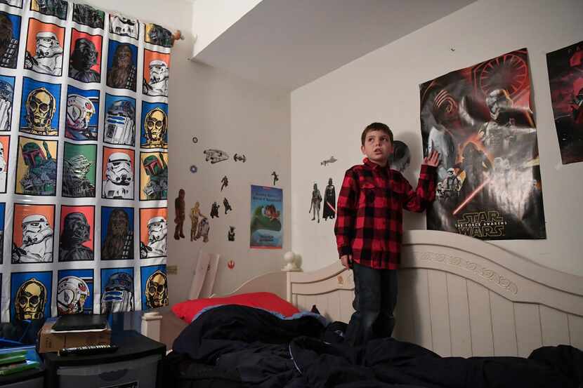 In this Dec. 13, 2016, photo, Joe Maldonado, 8, stands in his room in Secauscus, N.J. The...