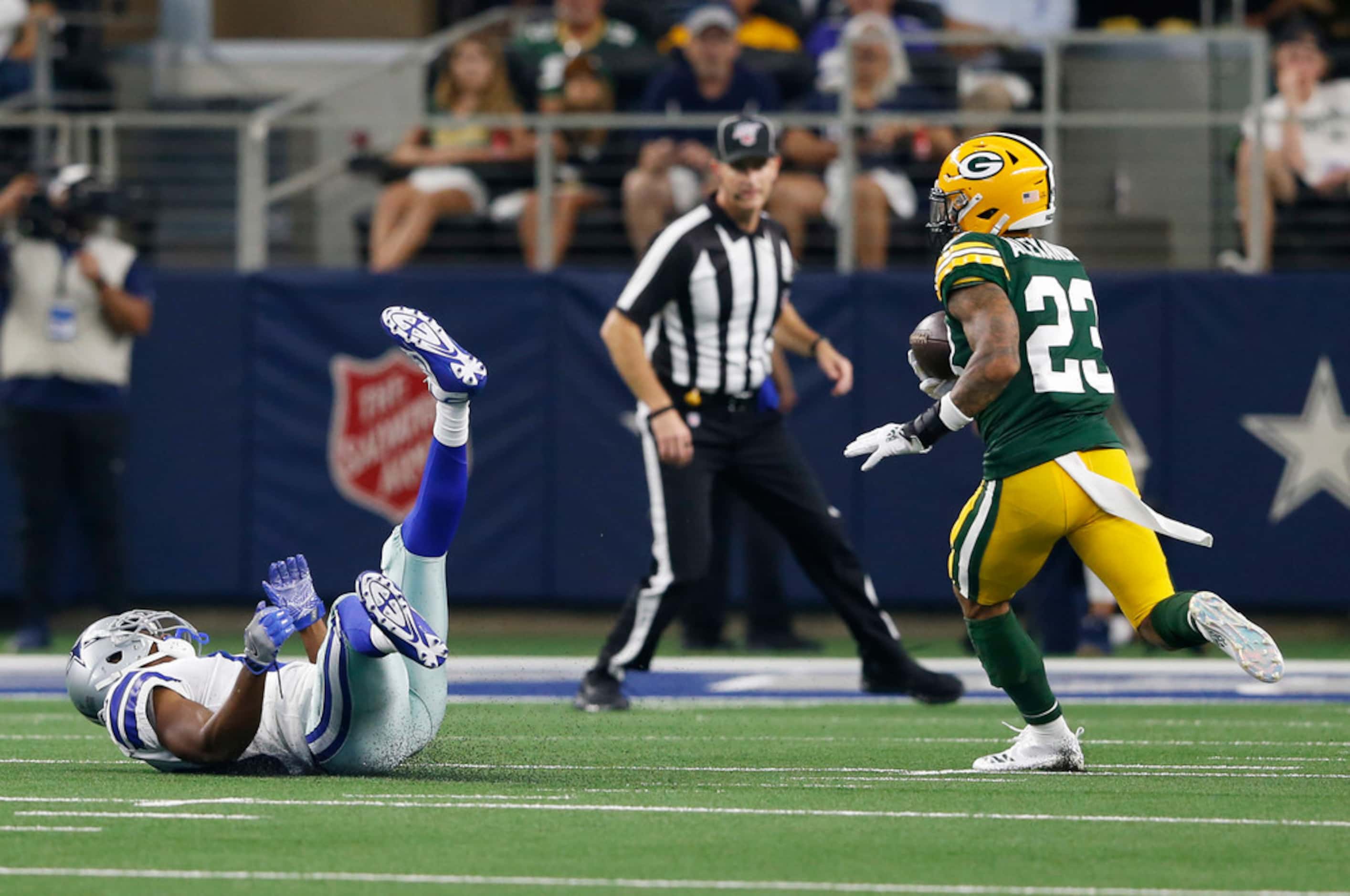 Green Bay Packers cornerback Jaire Alexander (23) intercepts a pass intended for Dallas...