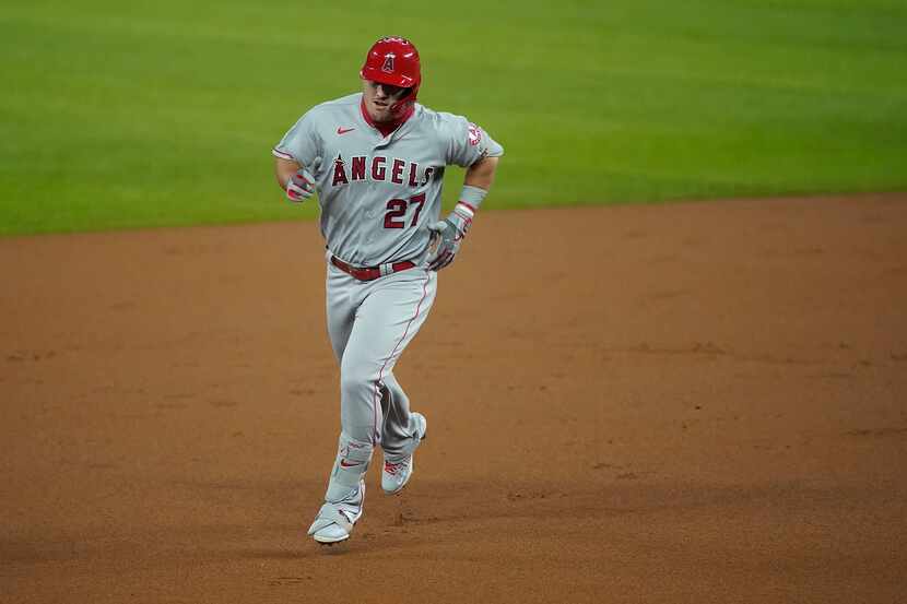 Los Angeles Angels center fielder Mike Trout rounds the bases after hitting a first inning...
