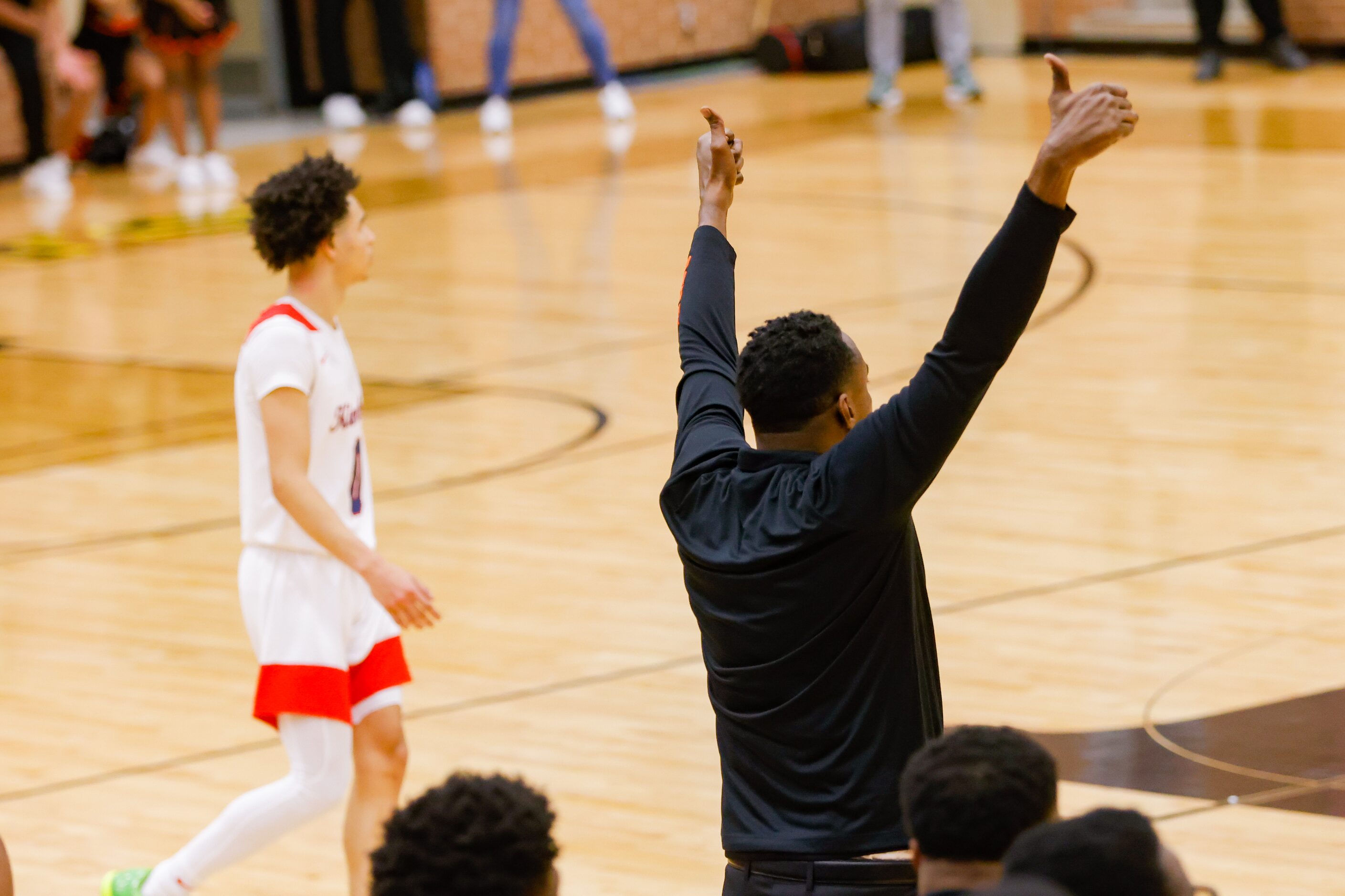 Lancaster's coach Ferrin Douglas celebrates his team catching up to Kimball before the end...