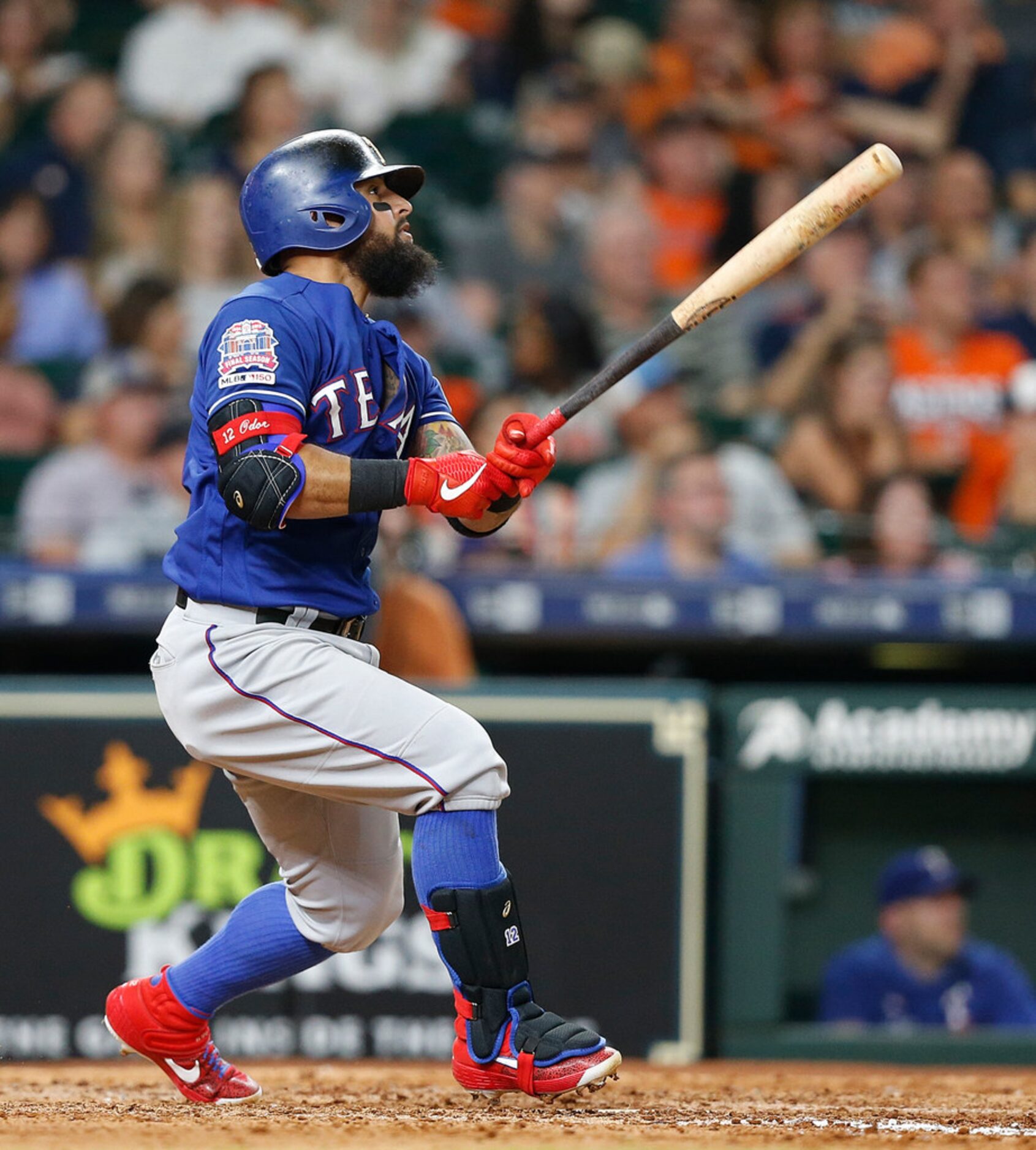 HOUSTON, TEXAS - JULY 19: Rougned Odor #12 of the Texas Rangers hits a home run in the sixth...