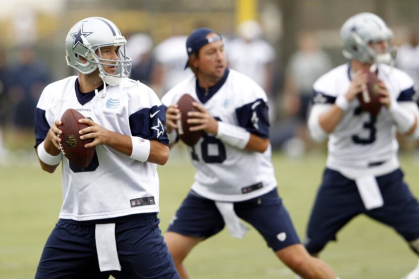 Dallas Cowboys quarterback Tony Romo (9), Dallas Cowboys quarterback Kyle Orton (18) and...