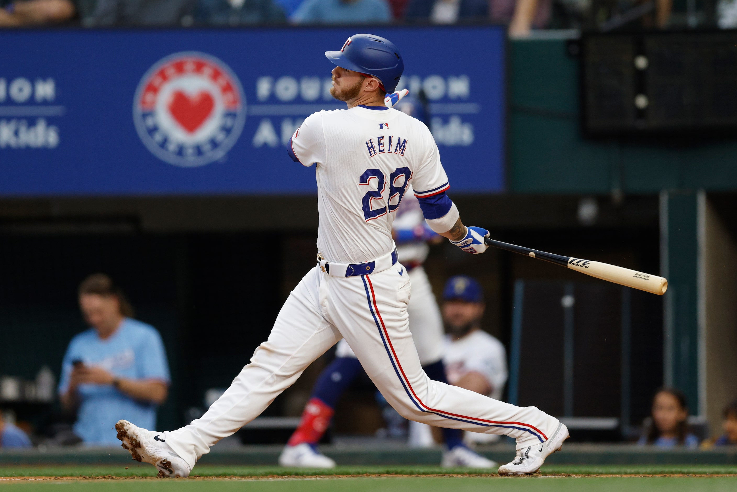 Texas Rangers catcher Jonah Heim (28) strikes out swinging during the second inning against...