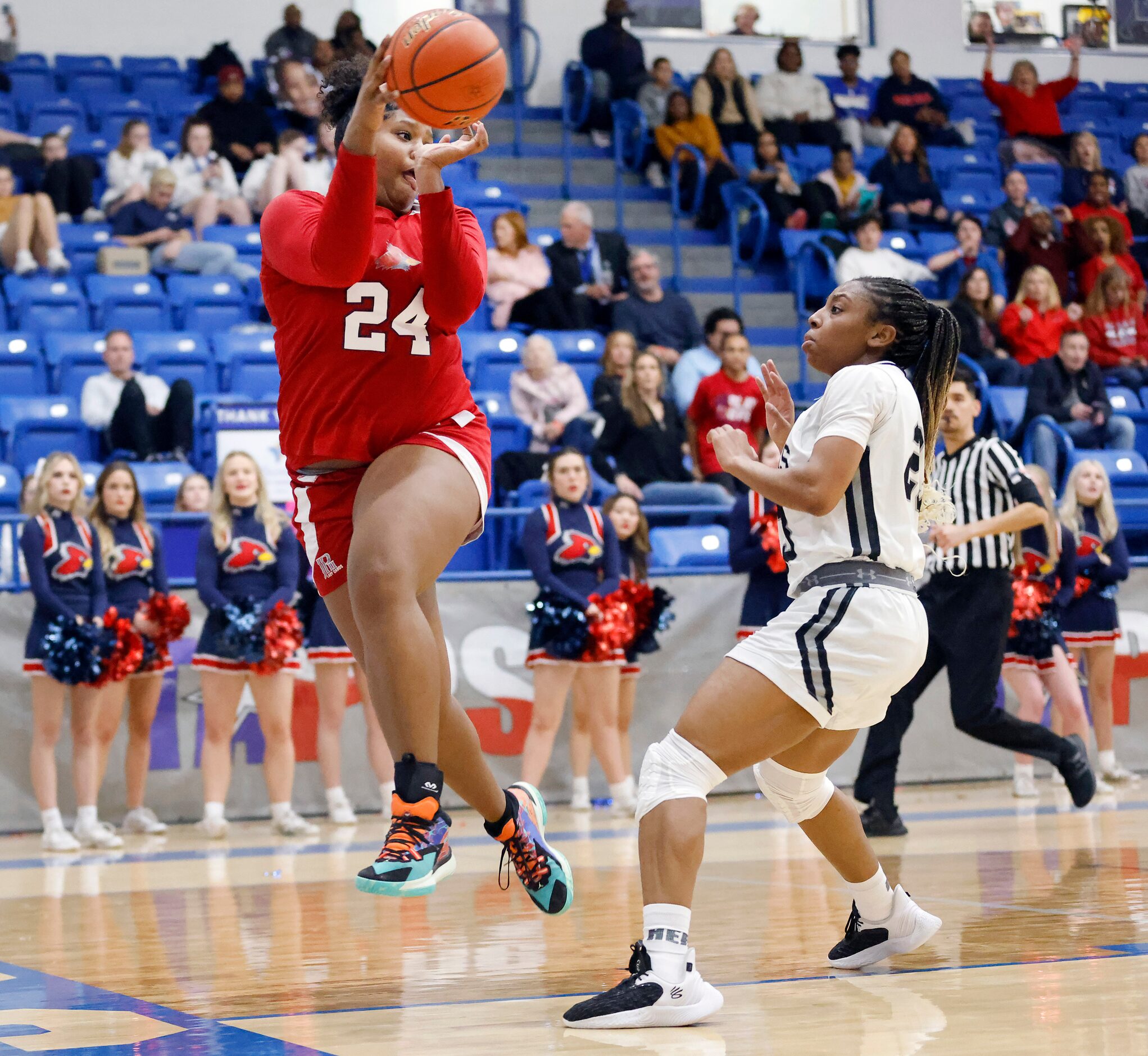 John Paul II forward Taylor Haggan (24) tries to save the ball from going out of bounds...