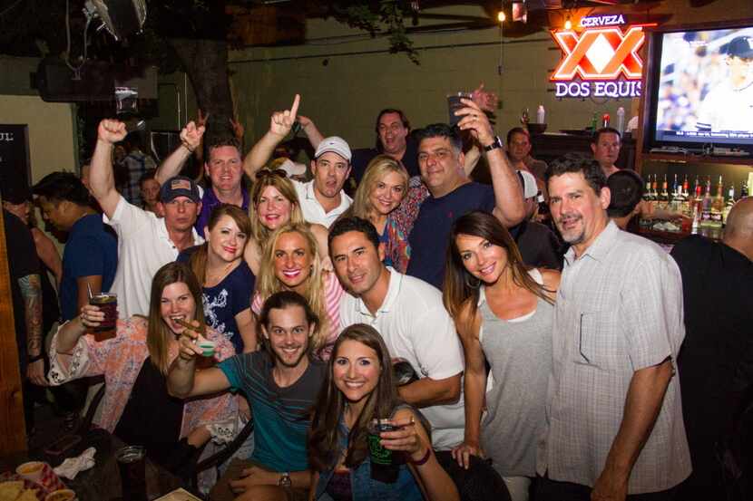 Groups of friends celebrated at The Ivy Tavern's first anniversary party on June 19, 2015
