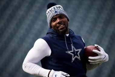 Dallas Cowboys wide receiver Dez Bryant warms up before an NFL football game against the...