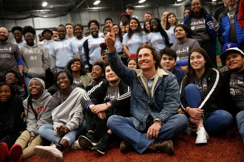 Matthew McConaughey poses for a photo with students from Sam Houston High School, Pinkston...