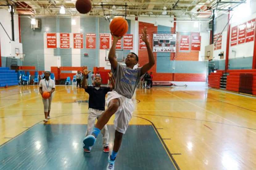 Seventh-grader Jody Chappell went up for a layup at Sam Houston Middle School in Irving in...