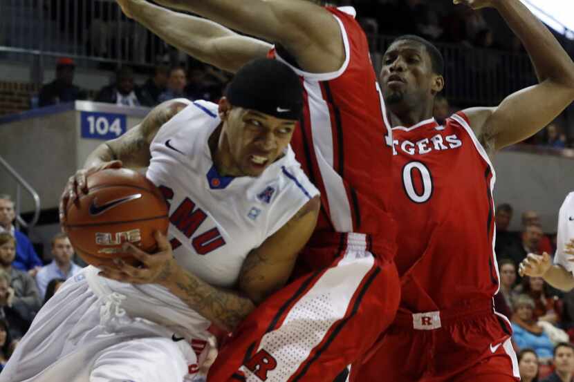 The high school grades for SMU guard Keith Frazier, left, were changed at Kimball High...