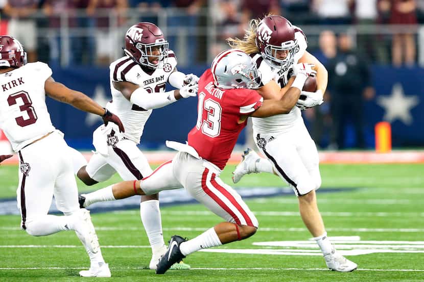 Texas A&M Aggies linebacker Cullen Gillaspia (12) returns an onside kick as he is tackled by...
