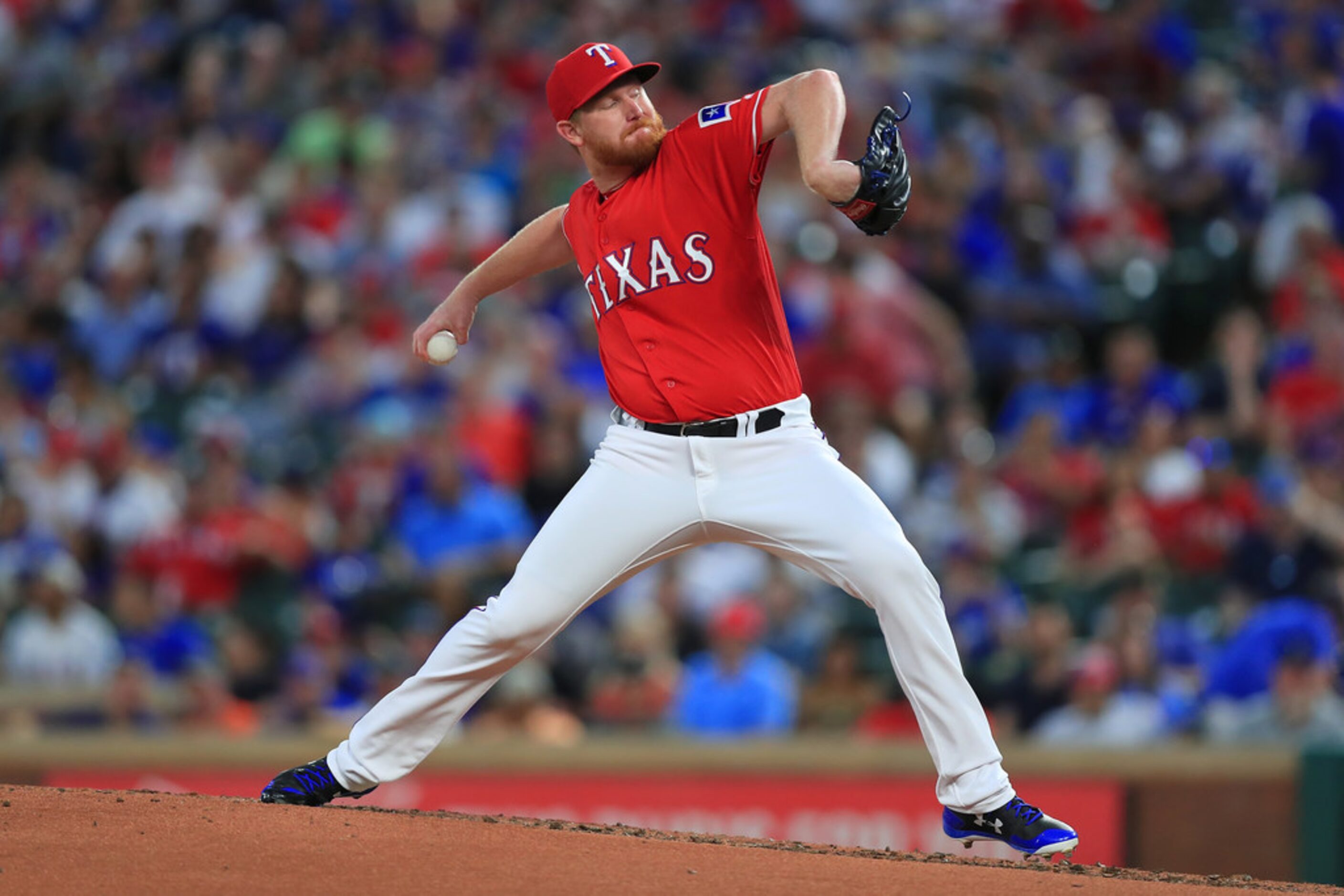 ARLINGTON, TX - AUGUST 28:  Eddie Butler #32 of the Texas Rangers pitches against the Los...