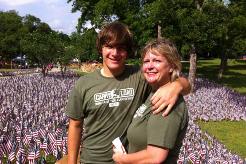 Charles Powell and his mother Laura Powell walked as part of part of Team Highland Park at...