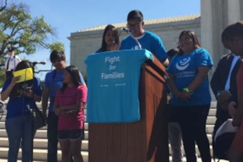  Luis Ortega, 21, (center at podium) and his sister Jacky Ortega, 15, (fourth from left)...