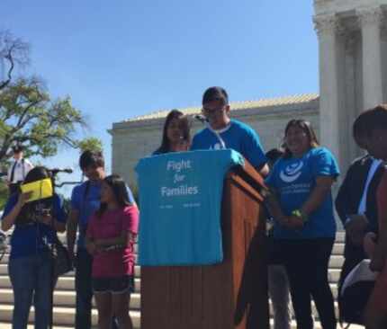  Luis Ortega, 21, (center at podium) and his sister Jacky Ortega, 15, (fourth from left)...