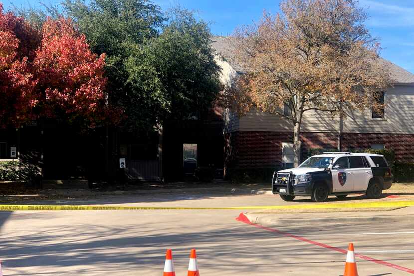 Police tape blocked off an apartment building in the 2300 block of Pebble Vale Drive, where...