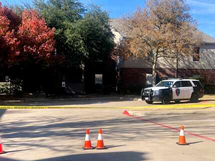 Police tape blocked off an apartment building in the 2300 block of Pebble Vale Drive where...
