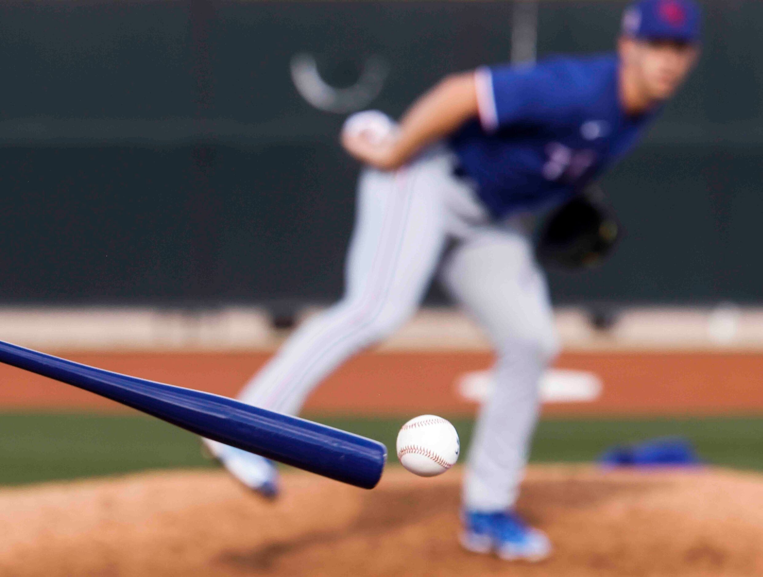 Texas Rangers special assistant Greg Maddux hits to  pitcher Glenn Otto during a fielding...