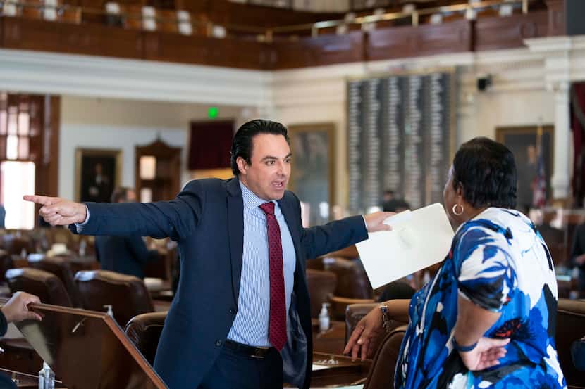 State Rep. Terry Canales, D-Edinburg, talks with Rep. Yvonne Davis, D-Dallas, on the House...