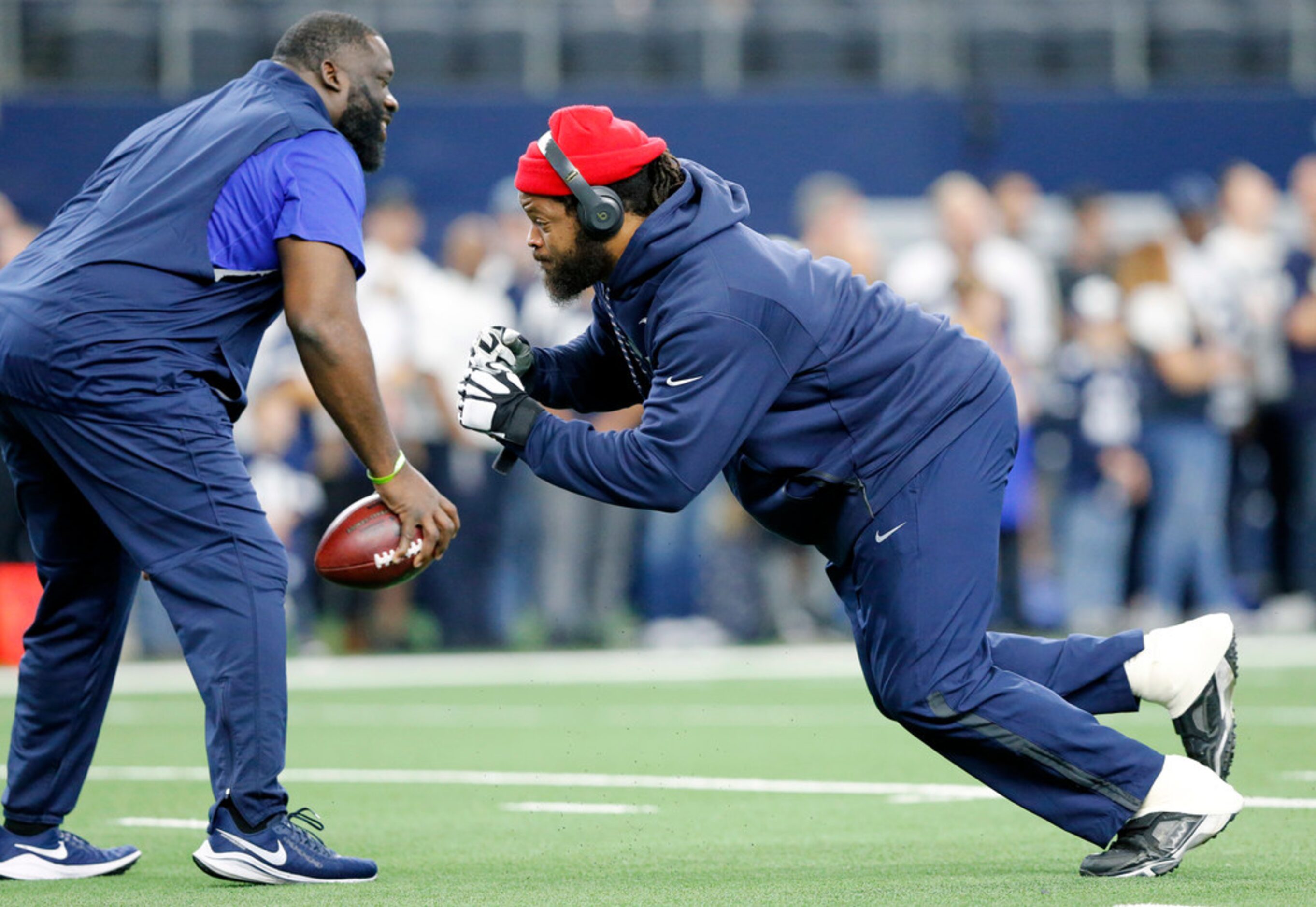 Dallas Cowboys defensive end Michael Bennett (79) runs through drills during pregame warmups...