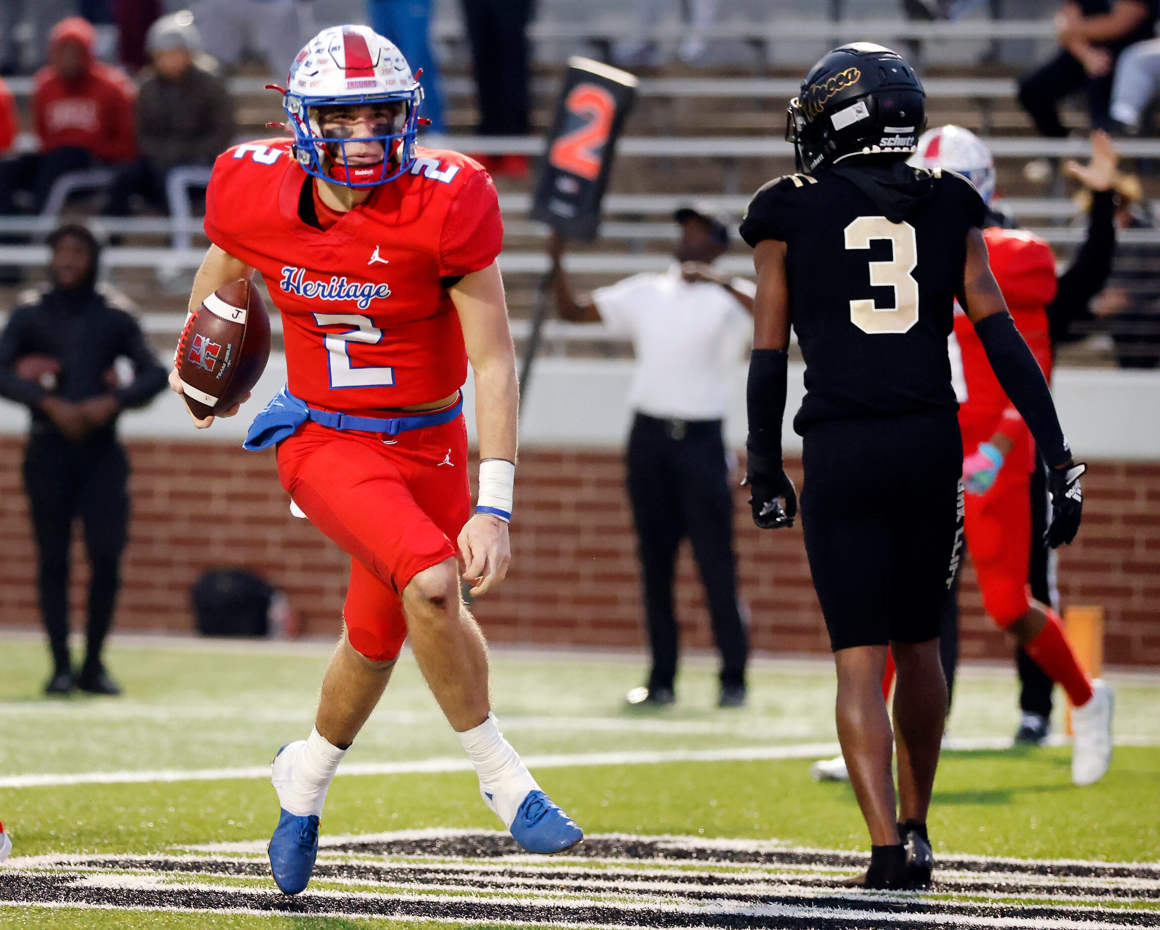 Midlothian Heritage quarterback Kaden Brown (2) celebrates his second half touchdown run...