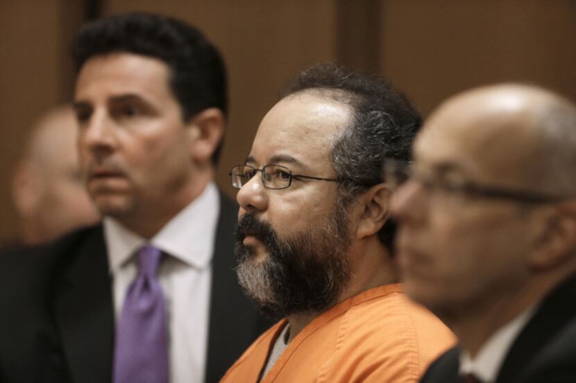 Ariel Castro (center) listens during court proceedings Friday in Cleveland. Castro, who...