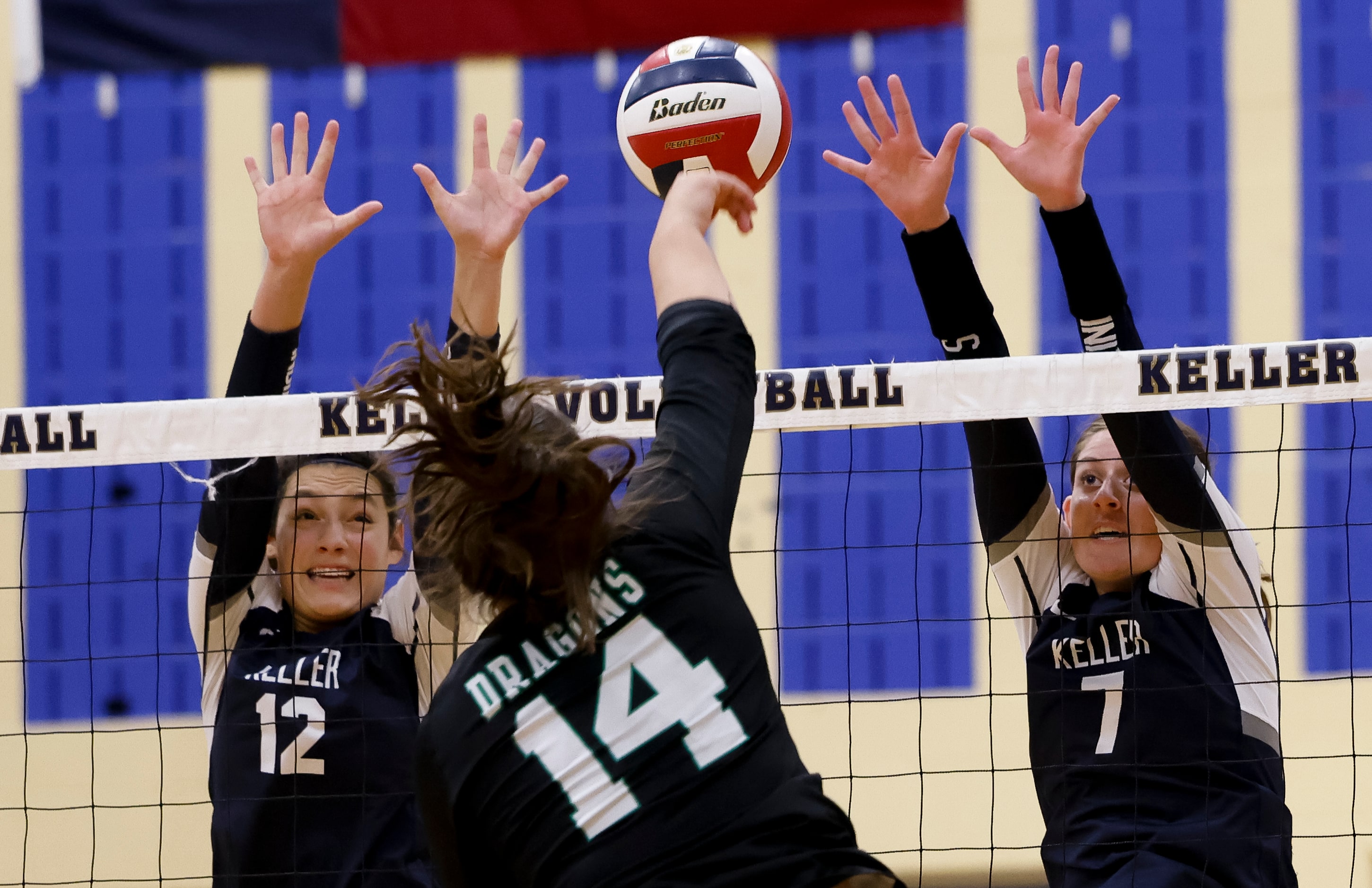 Keller’s Anna Flores (12) and Reagan Sharp (7) go up to block Southlake Carroll’s Kaylee...