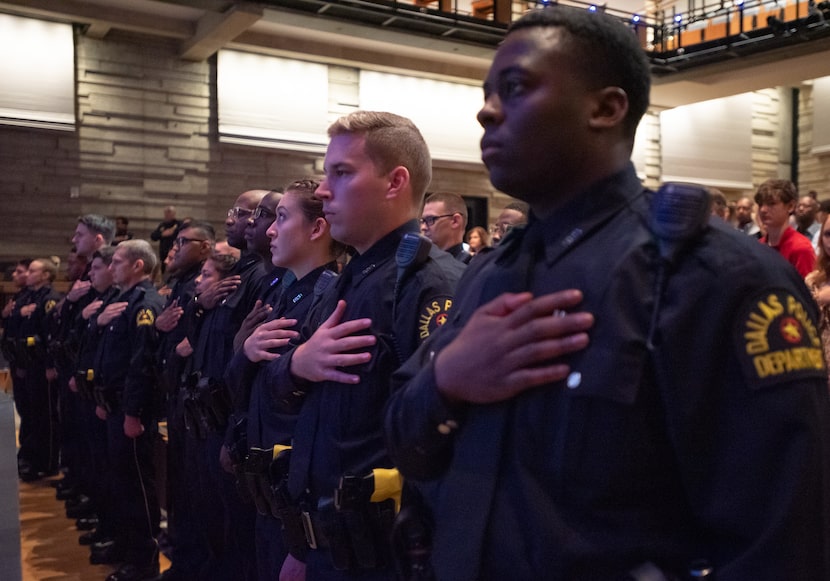 From left: police Officers Alyssa Hoppensteadt, Brennon Jones and Charles Jones, stand for...